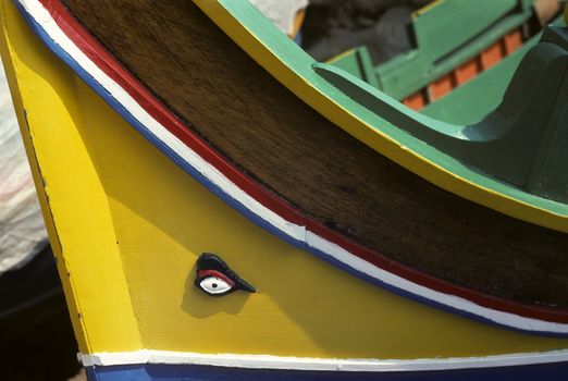 Bow of wooden sailing boat with carved eye on the prow