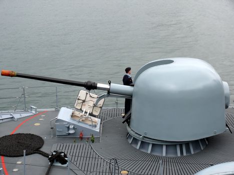 portrait of gun on a german navy ship in ocean