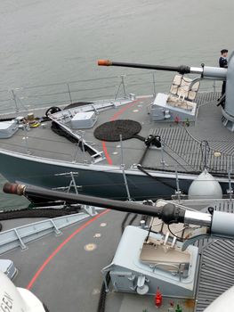 portrait of guns on a  german navy ship in ocean