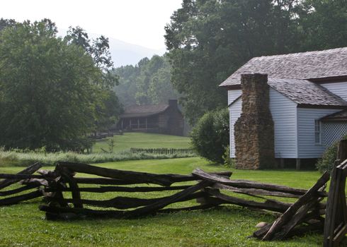 White wooden farm buildings with rustic fence in Smoky Mountains