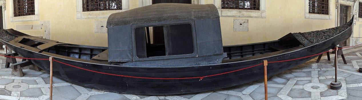 old gondola on display in Dodge's Palace in Venice