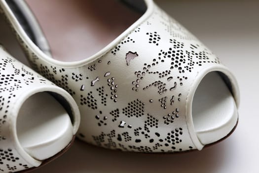Fashion wedding shoes for the bride close-up