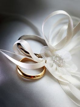 Wedding rings on a satiny fabric