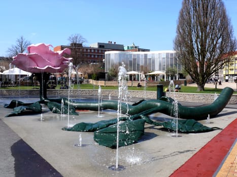 portrait of pink giant rose sculpture in park