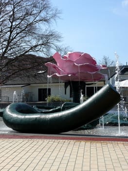 portrait of pink giant rose sculpture in park