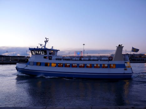 portrait of passenger boat on tour at evening cruising in canal 