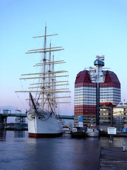 portrait of sail ship in the harbour in beautiful sunset