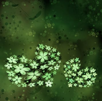 Two hearts from flowers on a green background