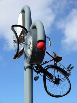 portrait of bicycle thrown in clock 