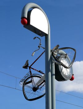 portrait of bicycle thrown in clock 