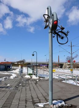 portrait of bicycle thrown in clock 