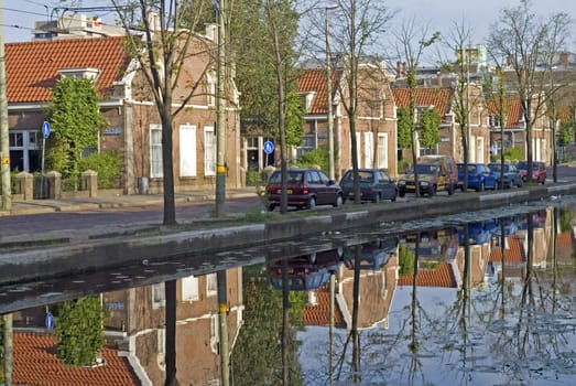 portrait of houses and reflections in water