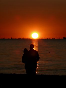 portrait of midnight sun infron couple enjoy the landscape