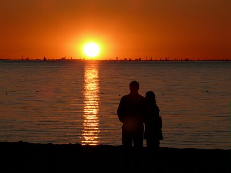 portrait of midnight sun and couple enjoy the landscape