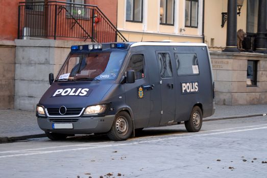 portrait of armored police van standing in the street