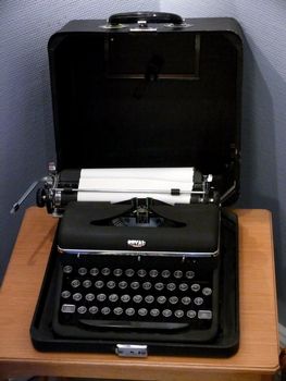 portrait of an old typewriter with paper