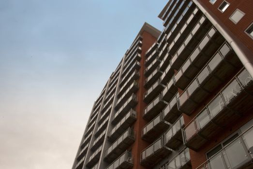 The Balconies of a modern apartment block in Yorkshire England under a blue sky