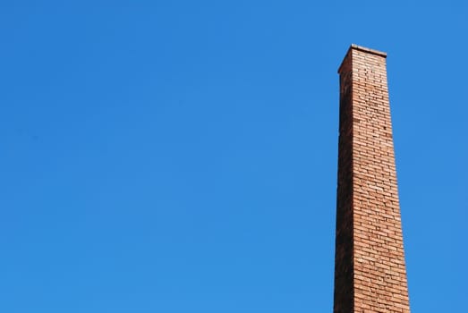 photo of a beautiful brick chimney with sky background