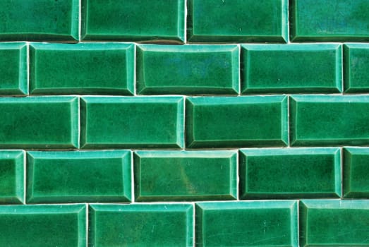 building wall made of green mosaics 