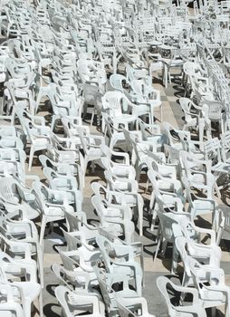 photo of empty white seats at a local music concert