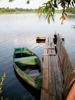 wooden boat moored  on the lake