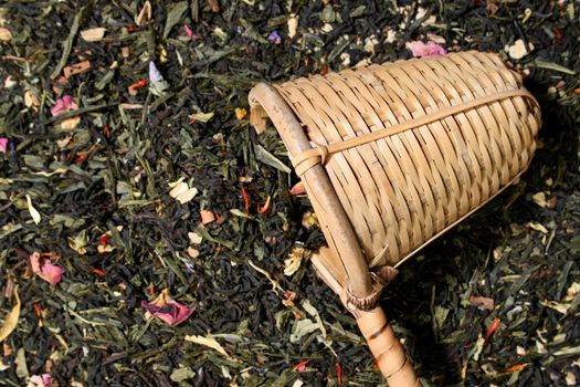 Wicker scoop over a tea leaves background, more in my gallery