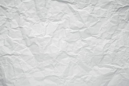 Crumpled white office paper texture.