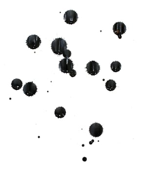 Splatters of black india ink on white paper.