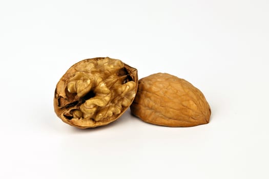Beaufiful composition of a walnut isolated on white background.