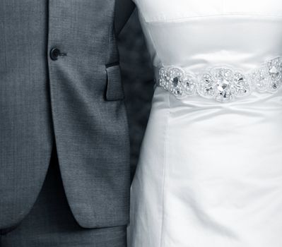 Suit of the groom and dress of the bride