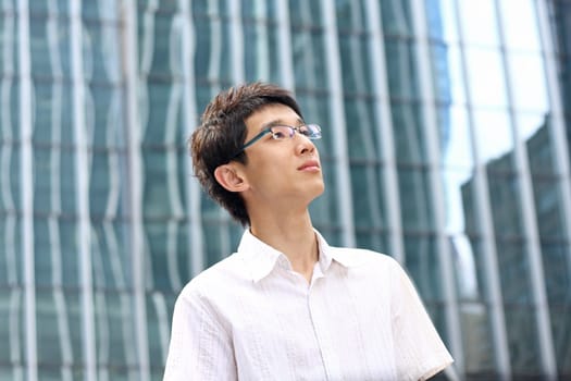 asian young, handsome business man at the office building . 