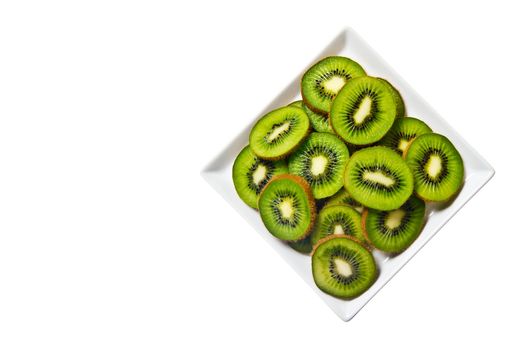 Kiwi fruit on a white plate and background.