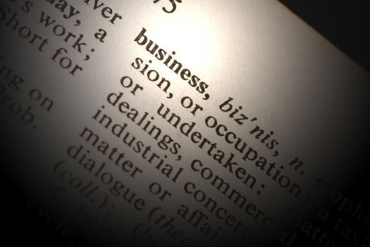 Closeup of the word business with a spot light on the text