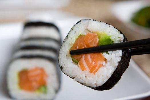 Fresh japanese salmon sushi served on a white plate