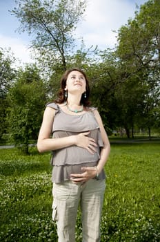 The portrait of the beautiful pregnant woman