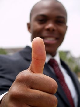 Black man giving thumbs up gesture