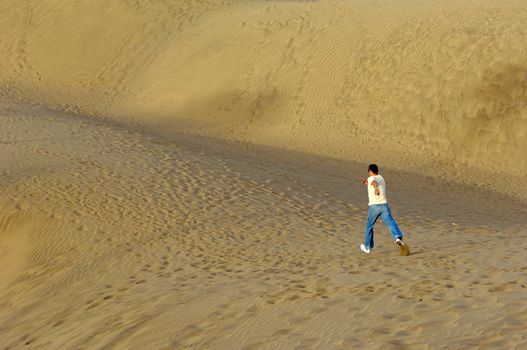 A man is running in the desert