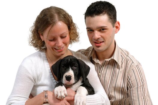 Young couple are sitting with their sweet dog