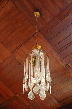 beautiful chandler hanging on brown wood ceiling