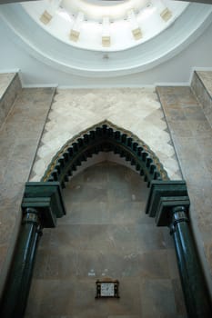 masjid hall with white marble wall and chandler