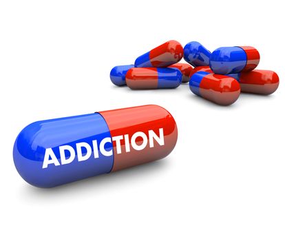 Close-up of some pills, with one featuring the word Addiction