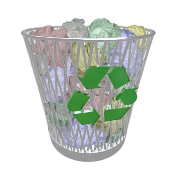 A metal recycling basket contains many crumpled up colored papers, symbolizing the recycling movement