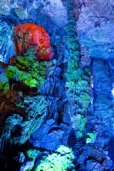 Image of stalactite and stalagmite formations all lighted up at Reed Flute Cave, Guilin, Guangxi Zhuang Autonomous Region, China.