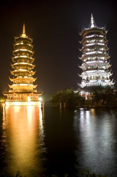 Night image of the Sun and Moon Pagodas at Guilin, China.