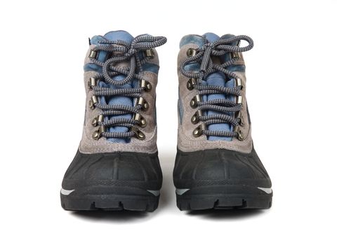 Man's waterproof boots with laces close up on a white background
