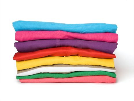 The combined multi-coloured clothes on a white background

