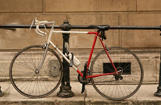 Two-wheeled bicycle parked in city street
