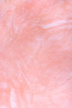 pink plaster with a deep relief on a wall