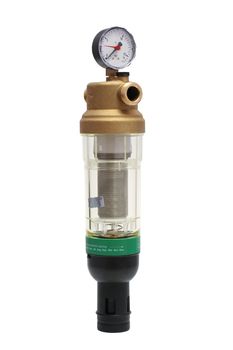 The filter with a manometer for water treating on a white background