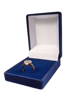 Gold ring in a dark blue box on a white background